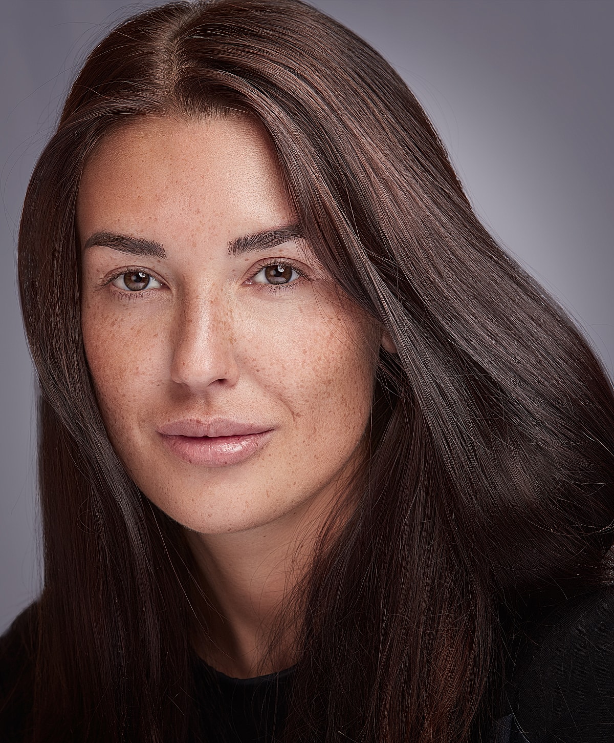 Fayetteville Brow Lift model with long, dark hair.