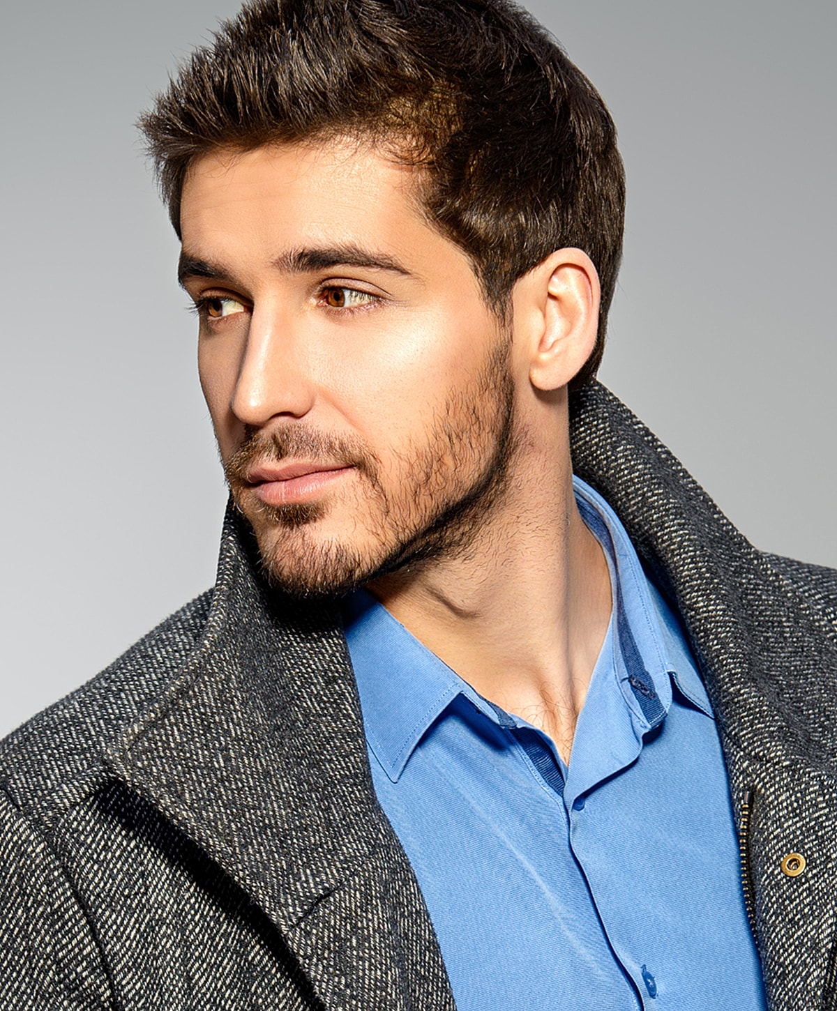 Fayetteville Facial Contouring for Men model in stylish coat and blue shirt.