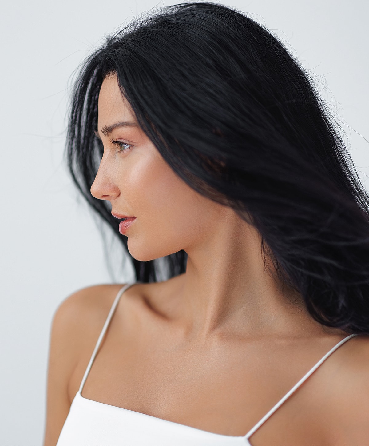 Fayetteville Skin Rejuvenation model with long dark hair.